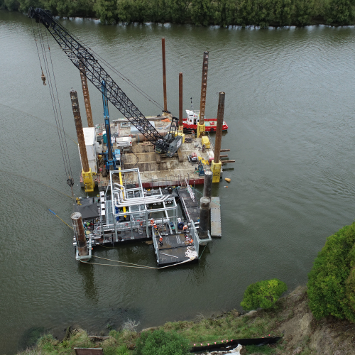 Pontoons with crane on river in New Zealand